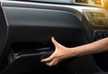 Hand open glove compartment box inside modern car Royalty Free Stock Photo