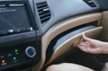 Hand open glove compartment box inside modern car Royalty Free Stock Photo