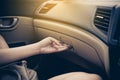 Hand open glove compartment box inside modern car Royalty Free Stock Photo