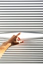 Hand open the jalousie Royalty Free Stock Photo