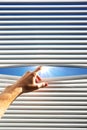 Hand open the jalousie Royalty Free Stock Photo