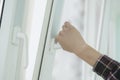a hand open window to get some fresh air inside the room Royalty Free Stock Photo