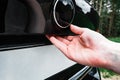 Hand opening the back door of the black car. Royalty Free Stock Photo