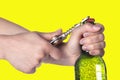 Hand opening beer bottle with metal opener