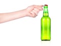 Hand opening beer bottle with metal opener Royalty Free Stock Photo