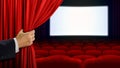 Hand opening curtain before movie show Royalty Free Stock Photo