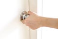 Hand opening door knob,white door Royalty Free Stock Photo