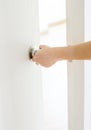Hand opening door knob,white door Royalty Free Stock Photo