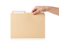 Hand opening a manilla folder Royalty Free Stock Photo