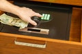 Hand opening safe in hotel to store valuables