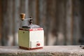 Hand-operated old wooden coffee or spices grinder