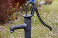 Hand-operated water pump with long handle Royalty Free Stock Photo