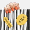 Hand orange nail polish on a striped background