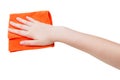 Hand with orange wiping rag isolated on white Royalty Free Stock Photo