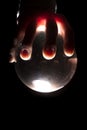 Hand over a lighted ball Royalty Free Stock Photo