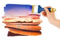 Hand with paintbrush painting sunset Royalty Free Stock Photo
