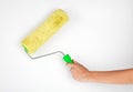 Hand with paintbrush roller Royalty Free Stock Photo