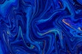 Hand painted background with mixed liquid blue and golden paints. Abstract fluid acrylic painting. Modern art. Marbled Royalty Free Stock Photo