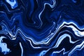 Hand painted background with mixed liquid blue paints. Abstract fluid acrylic painting. Modern art. Marbled blue Royalty Free Stock Photo