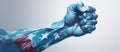 A hand painted in the colors of the US flag clenched in a fist on a blue background, symbolizing strength