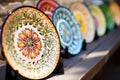 hand-painted decorative ceramic dinner plates lined up