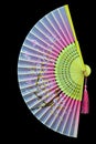 Hand painted decorative chinese bamboo folding fan on dark background.