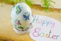 Hand painted decoupage Easter egg on a wooden surface Royalty Free Stock Photo