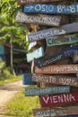 Hand painted direction wood signs to different cities of the world, Laos Royalty Free Stock Photo