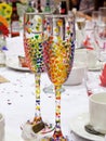 Hand painted hearts on wedding champagne glasses on wedding breakfast table Royalty Free Stock Photo