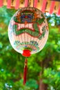 Hand-painted lantern in Taiwan. Hand painted lampion with frightening dragon face in green and red on white