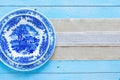 Hand painted plate on wooden background Royalty Free Stock Photo