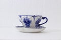 hand-painted porcelain cups with blue flowers