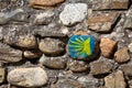 Hand painted sign of the Camino de Santiago on a stone wall Royalty Free Stock Photo