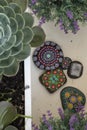 Hand-painted stones with mandalas as concentration and mindfulness exercise