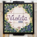 Hand-painted tile sign for Violeta, an accessories store in Sintra, Portugal.