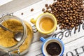 Cup of coffee and coffee beans and cane sugar Royalty Free Stock Photo