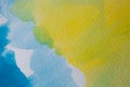 Hand painted watercolor background. Yellow and blue watercolor brush strokes on textured paper. Royalty Free Stock Photo