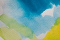 Hand painted watercolor background. Yellow and blue watercolor brush strokes on textured paper. Royalty Free Stock Photo