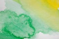 Hand painted watercolor background. Yellow and green abstract watercolor brush strokes on textured paper. Royalty Free Stock Photo