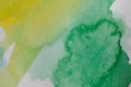 Hand painted watercolor background. Yellow and green abstract watercolor brush strokes on textured paper. Royalty Free Stock Photo