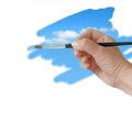 Hand painting blue sky with paintbrush Royalty Free Stock Photo