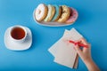 Hand painting heart with tea and donuts Royalty Free Stock Photo