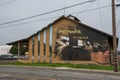 Hand painting on a wall in Live Oak, California