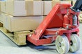 Hand pallet truck with cardboard boxes Royalty Free Stock Photo