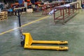 Hand pallet truck jack in factory warehouse. Hydraulic hand pallet jacks. Pallet truck with empty Royalty Free Stock Photo