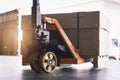 Hand pallet truck with shipment pallet goods waiting for load into a truck. Cargo freight and warehouse shipping.