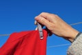 Hand pegging clothes out to dry Royalty Free Stock Photo