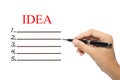 Hand with Pen and Idea Checklist