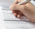 Hand with pen over application form, Filling name in personal detail Royalty Free Stock Photo