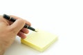 Hand With Pen and Post-it Royalty Free Stock Photo